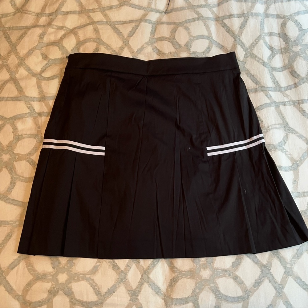 NWOT Golfino golf skirt. Black with a white stripe.